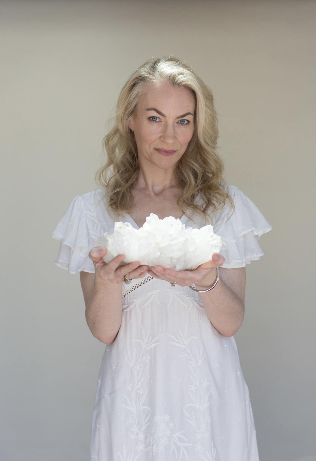 Andrea Wright holding a crystal cluster